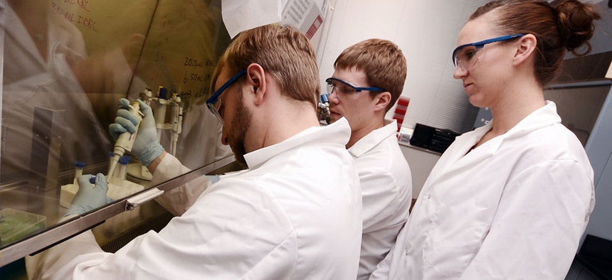 Biology and chemistry graduate students work in a lab at the university in Sioux Falls, SD.