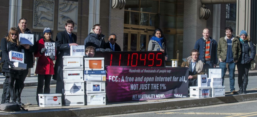 Members of US advocacy groups camp outside FCC headquarters in Washington, DC, on Jan. 30, 2014