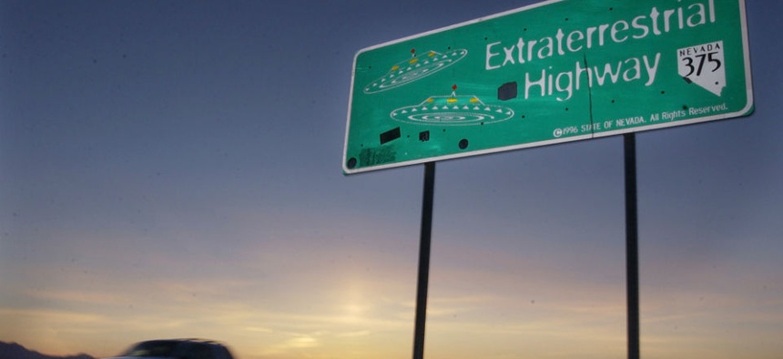 A car moves along the Extraterrestrial Highway near Rachel, Nevada, and along the border of Area 51.