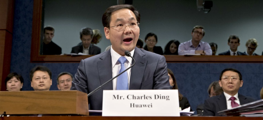 House Permanent Select Committee on Intelligence holds a hearing with Charles Ding, center, Huawei Technologies senior vice president for the U.S.