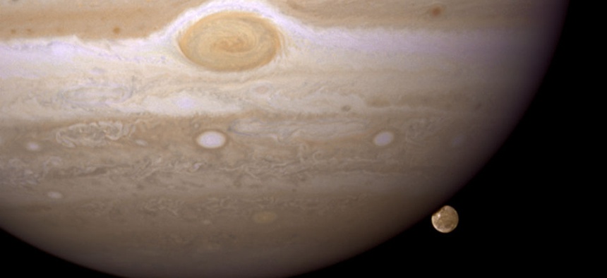 Jupiter's moon Ganymede playing a game of "peek-a-boo."