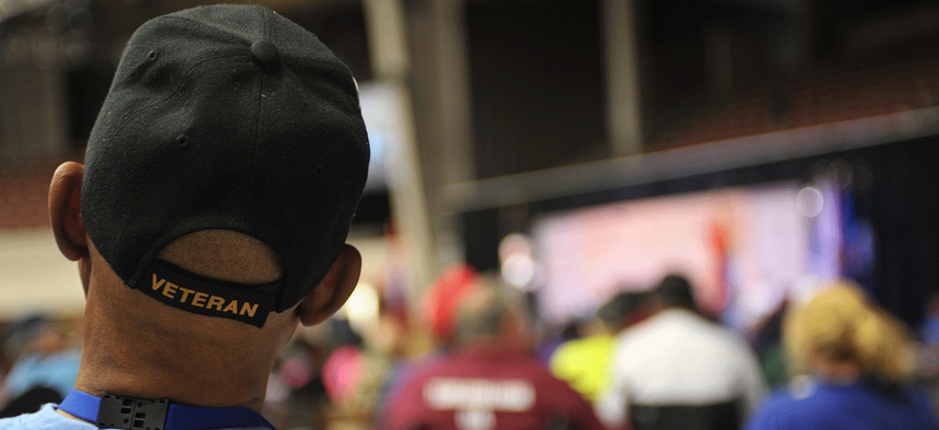A man watches the Opening Ceremonies of the 28th National Veterans Golden Age Games.
