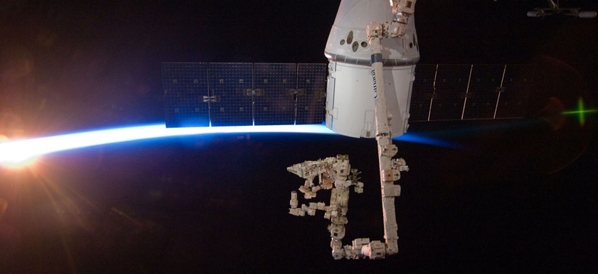 The SpaceX Dragon capsule berths at the International Space Station