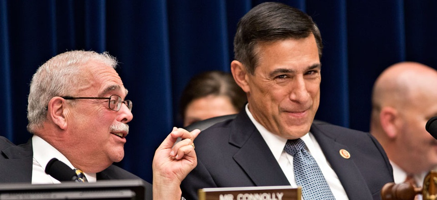House Oversight Committee Chairman Darrell Issa, R-Calif., right, reacts to Rep. Gerry Connolly, D-Va.