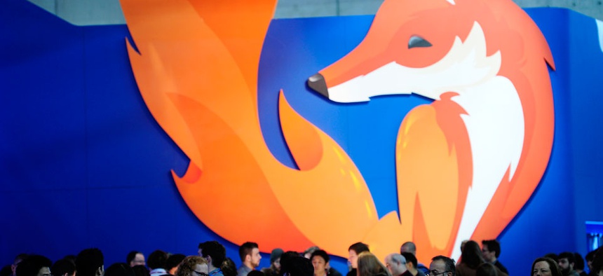 People gather in the Firefox booth at the Mobile World Congress, the world's largest mobile phone trade show in Barcelona, Spain.