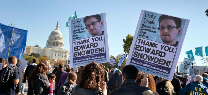 Demonstrators rally at the U.S. Capitol to protest spying on Americans by the National Security Agency.