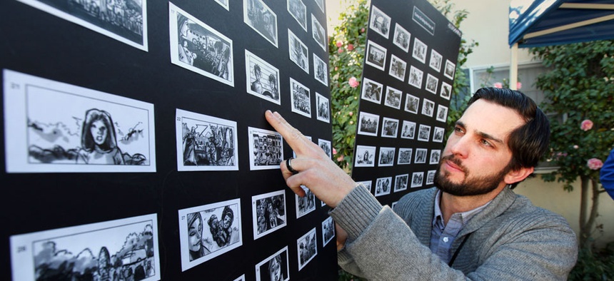 Nathan Crow, Creative Director at RPA: Rubin Postaer and Associates, an advertisement agency, checks a story board for a Superbowl ad.