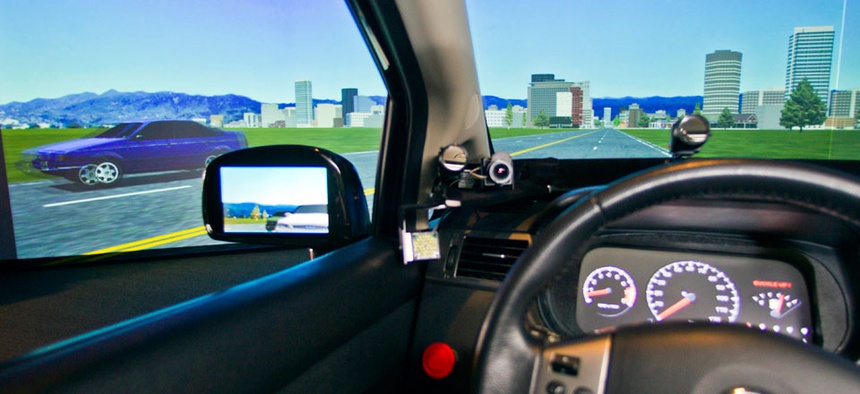 A driving telematics simulator is demonstrated at the University of Michigan Transportation Research Institute in Ann Arbor, Mich.