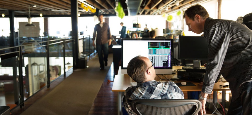 Employees at AmigoCloud, one of the GovTech Fund's portfolio companies, hard at work.