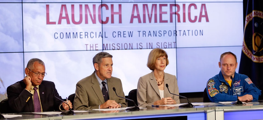 From left, NASA Administrator Charles Bolden, Kennedy Space Center Director Bob Cabana, Commercial Crew Program Manager Kathy Lueders and Astronaut Mike Fincke, announce NASA's choice of Boeing and SpaceX to ferry astronauts to the ISS.