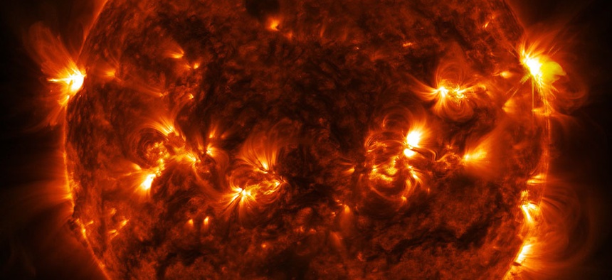A solar flare erupts on the far right side of the sun, in this image captured by NASA's Solar Dynamics Observatory.