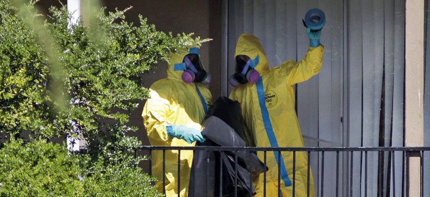 Hazardous material cleaners arrives at the apartment complex in Dallas, Friday, Oct. 3, 2014, where Thomas Eric Duncan, the Ebola patient who traveled from Liberia to Dallas stayed last week.