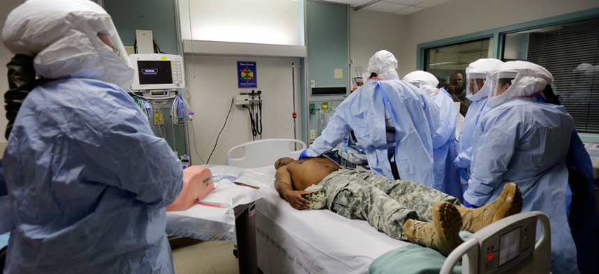 Members of the Department of Defense's Ebola Military Medical Support Team go through special training at San Antonio Military Medical Center.