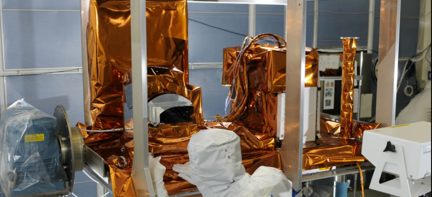 The Ozone Mapping and Profiler Suite (OMPS) instrument, part of the JPSS satellite system, undergoes post thermal inspection at a Ball facility in Boulder, Colo.