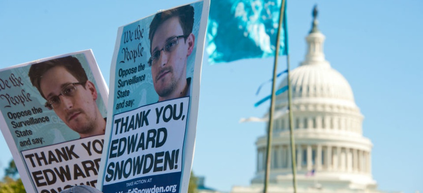 Signs held by protesters during a rally against mass surveillance in Washington, D.C., on October 26, 2013.