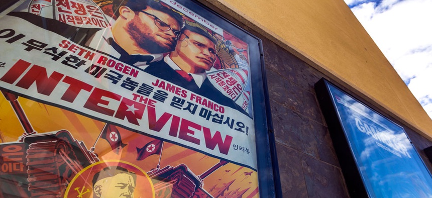 A movie poster for the movie "The Interview" is displayed outside the AMC Glendora 12 movie theater Wednesday, Dec. 17, 2014, in Glendora, Calif.