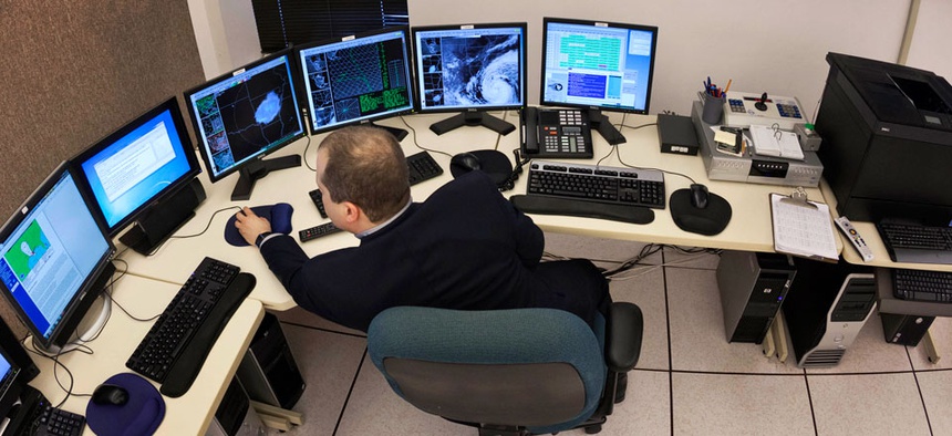 Science and operations officer Christopher Buonanno monitors data on Hurricane Isaac at the National Weather Service Warning and Forecast Office in North Little Rock, Ark.
