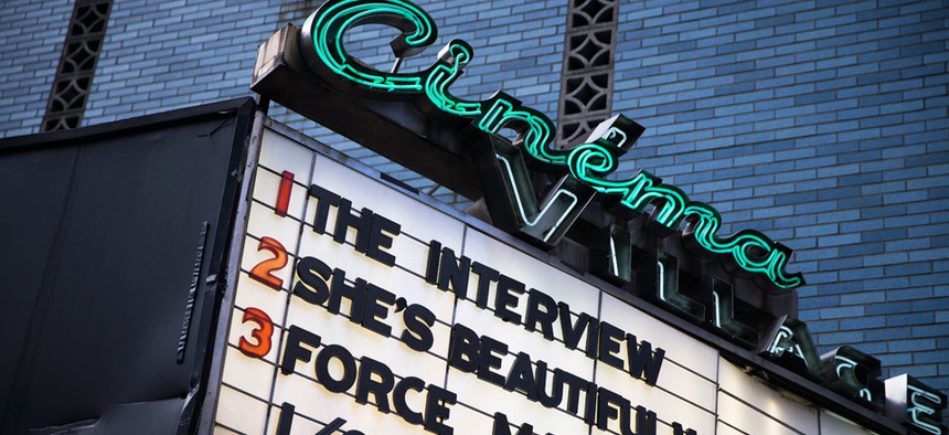 "The Interview" is listed on the Cinema Village movie theater marquee, Thursday, Dec. 25, 2014, in New York.