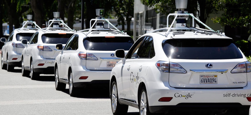 A row of Google self-driving cars outside the Computer History Museum in Mountain View, Calif.