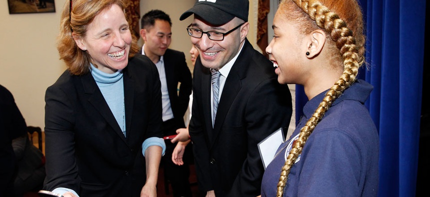 CTO Megan Smith shares a laugh with a middle school student from Newark, N.J. and Code.org Founder Hadi Partovi, center, after teaching U.S. President Barack Obama how to code at the White House.