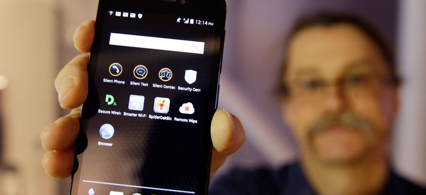 Silicon Valley pioneer and Silent Circle co-founder Jon Callas holds up Blackphone with encryption apps displayed on it at the Computer History Museum in Mountain View, Calif.