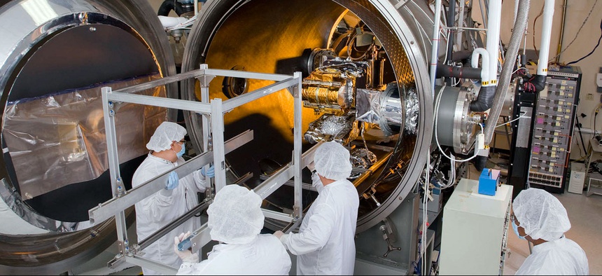 Engineers work on the CERES Instrument which will be integrated onto the Joint Polar Satellite System spacecraft, scheduled for launch in early 2017.