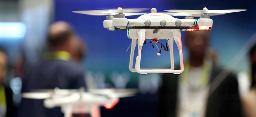 Drones fly at the Autel booth during the International CES Wednesday, Jan. 7, 2015, in Las Vegas.