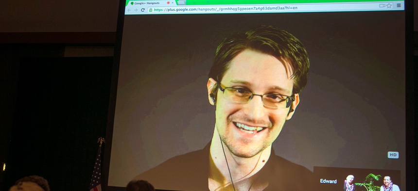 National Security Agency leaker Edward Snowden appears on a live video feed broadcast from Moscow at an event sponsored by the ACLU Hawaii in Honolulu.