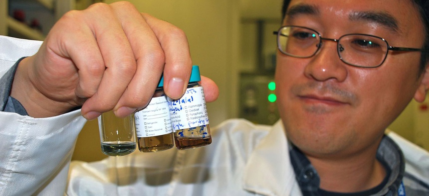 An IBM researcher observes different solutions of carbon nanotubes.