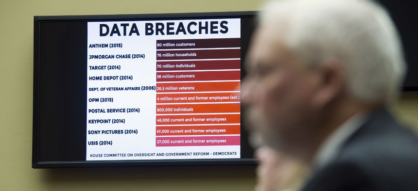 A chart of data breaches is shown on Capitol Hill in Washington, Tuesday, June 16, 2015, as witnesses testify before the House Oversight and Government Reform committee's hearing on the Office of Personnel Management (OPM) data breach.