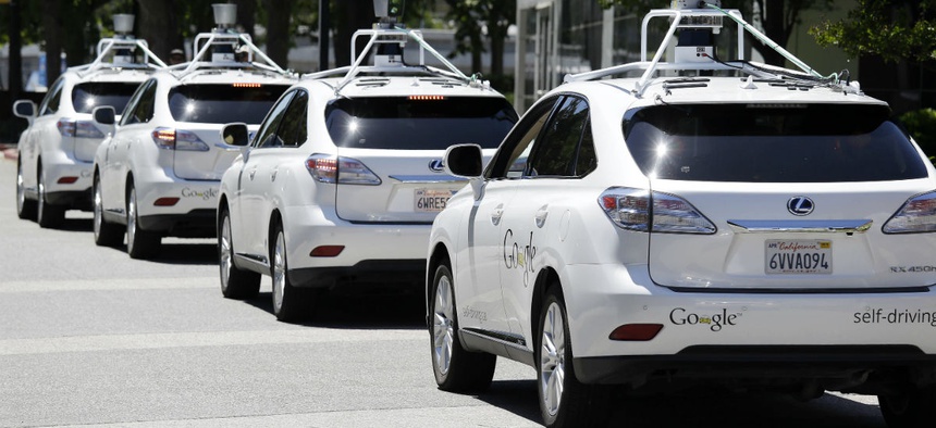 FILE - This May 13, 2014 file photo shows a row of Google self-driving Lexus cars at a Google event outside the Computer History Museum in Mountain View, Calif.