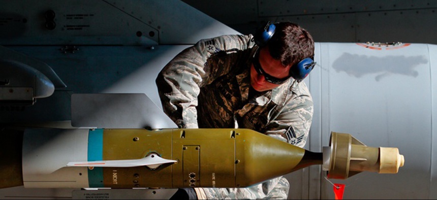 An Airman assembles fins on a GBU-12 Paveway II mounted on an F-16C Fighting Falcon on Jan. 9 at Atlantic City Air National Guard Base, N.J.