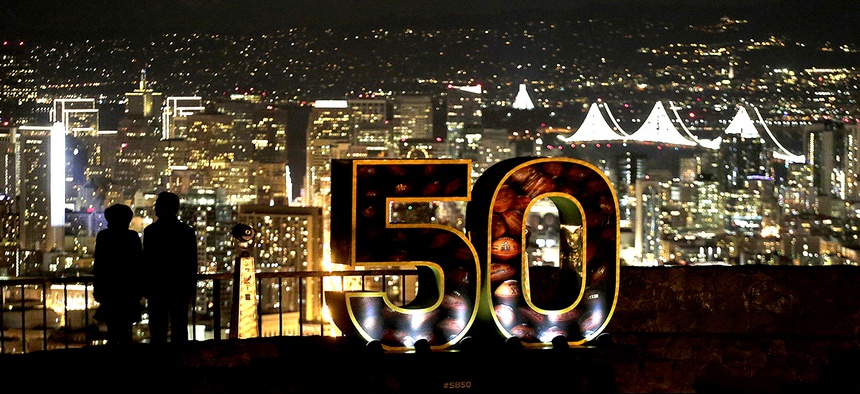 A Super Bowl 50 sign stands in a park overlooking San Francisco Wednesday, Feb. 3, 2016.