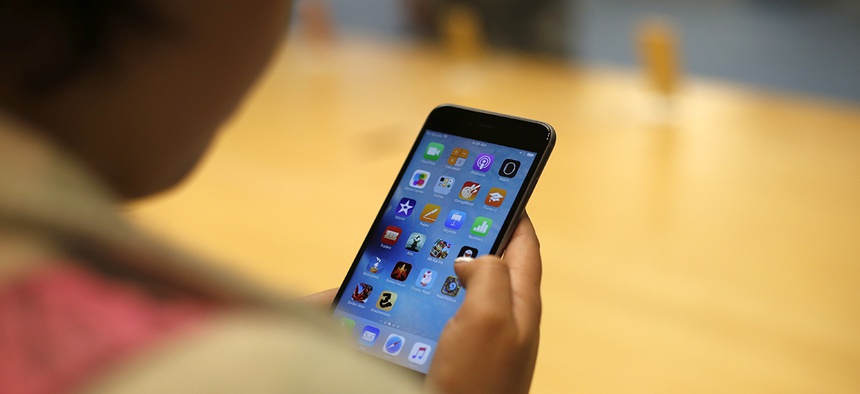A customer tries out the new Apple iPhone 6S at an Apple store in Chicago.
