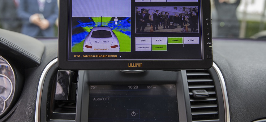 A display inside a Tesla Model 90D during a demonstration of self driving car technology on Capitol Hill, on Tuesday, March 15, 2016.