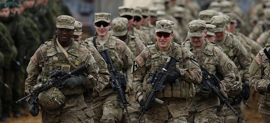 members of the U.S. Army B Company, 2nd Battalion, 8th Cavalry Regiment, 1st Brigade Combat Team, 1st Cavalry Division attend a military exercise 'Iron Sword 2014', at the Gaiziunu Training Range in Lithuania.