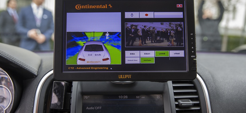 A display inside a Tesla Model 90D during a demonstration of self driving car technology on Capitol Hill, on Tuesday, March 15, 2016.