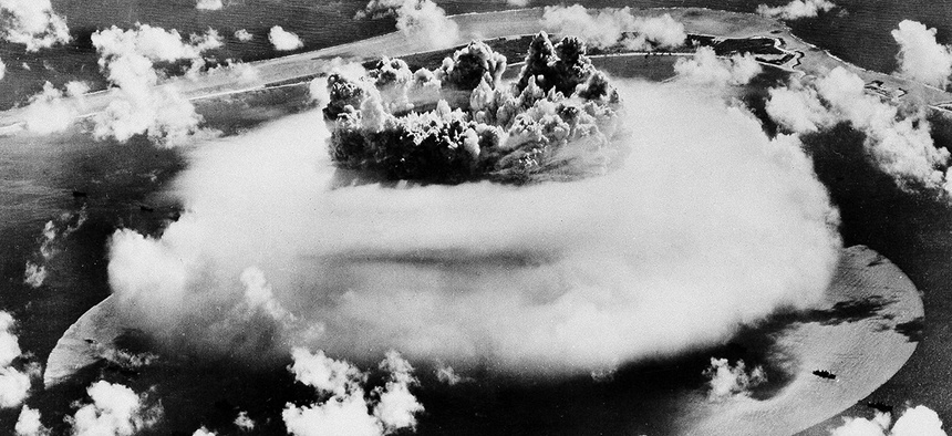 The water column from the underwater atom bomb blast in the lagoon of the Bikini Atoll Islands rises through the disintegrating vapor cloud, on July 25, 1946.