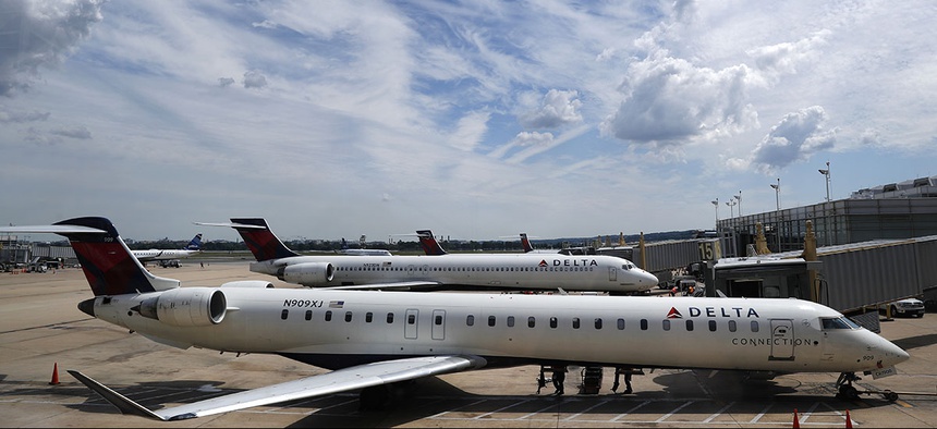 Delta Air Lines planes are seen on the tarmac at Washington's Ronald Reagan Washington National Airport, Monday, Aug. 8, 2016.