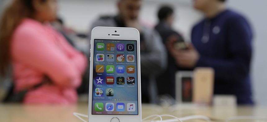 The new iPhone SE is seen on display at the Apple Store Thursday, March 31, 2016, in Palo Alto, Calif.
