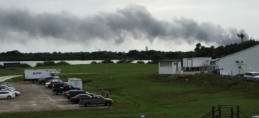 Smoke rises from a SpaceX launch site Thursday, Sept. 1, 2016, at Cape Canaveral, Fla. NASA said SpaceX was conducting a test firing of its unmanned rocket when a blast occurred.