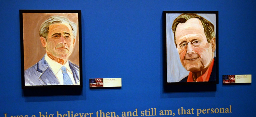 Portraits of former Presidents George W. Bush, left, and his father, George H.W. Bush, both painted by George W. Bush, are on display as part of "The Art of Leadership: A President's Diplomacy" exhibit.