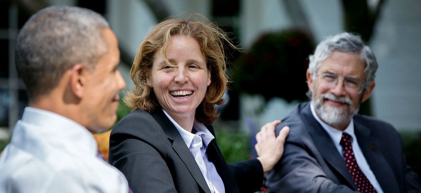 President Barack Obama talks with Megan Smith, U.S. Chief Technology Officer, and Dr. John Holdren, Director of the Office of Science and Technology Policy, during a technology strategy discussion in the Rose Garden of the White House, Oct. 8, 2014.