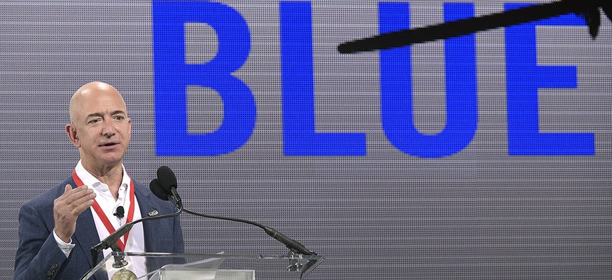 Amazon CEO Jeff Bezos addresses reporters and guests during a news conference unveiling the new Blue Origin rocket at the Cape Canaveral Air Force Station.