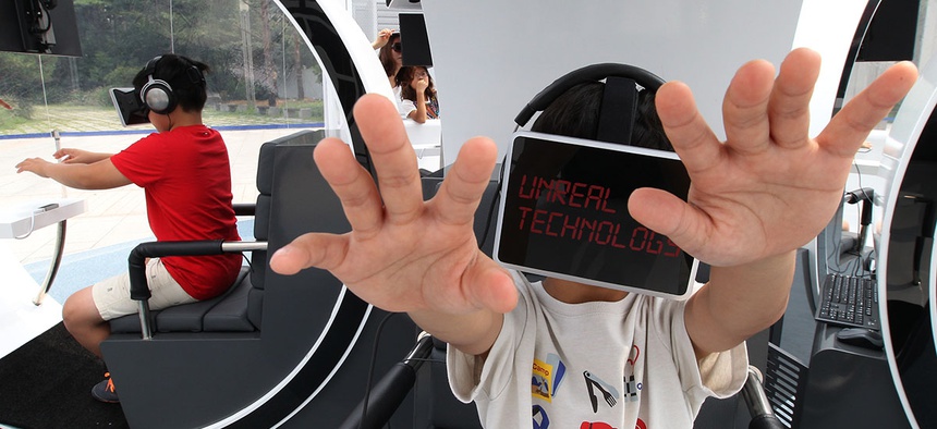 Children wearing the Oculus Rift virtual reality headsets, experience virtual reality technology.