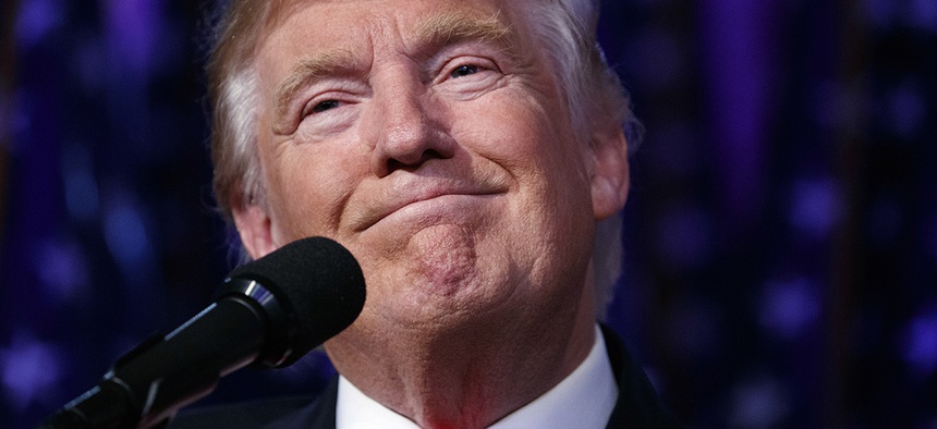 U.S. President-elect Donald Trump smiles as he arrives to speak at an election night rally, early Wednesday, Nov. 9, 2016, in New York.