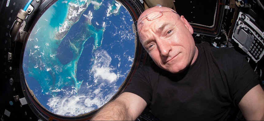 Astronaut Scott Kelly takes a photo of himself inside the Cupola, a special module of the International Space Station which provides a 360-degree viewing of the Earth and the station.