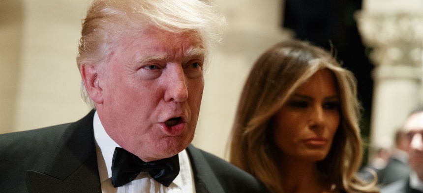 President-elect Donald Trump talks to reporters during a New Year's Eve party at Mar-a-Lago, Saturday, Dec. 31, 2016.