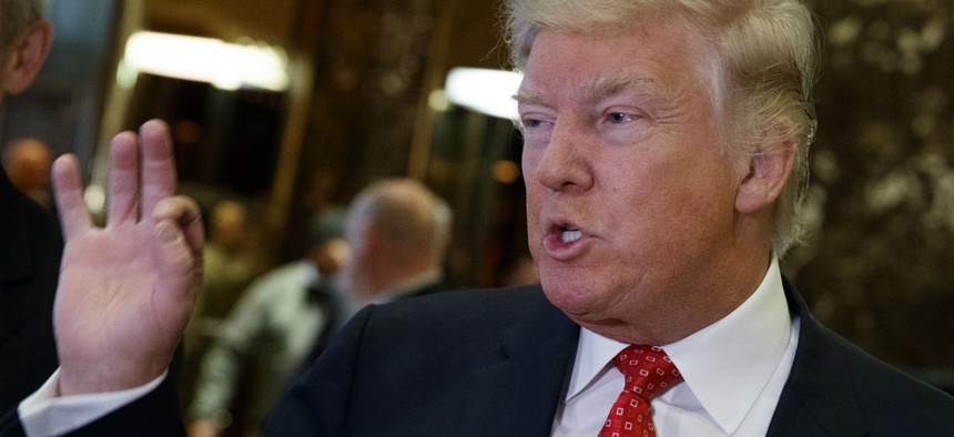 President-elect Donald Trump talks with reporters at Trump Tower in New York.