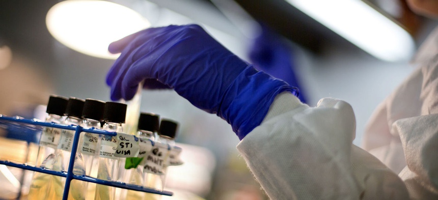 A microbiologist works with tubes of bacteria samples in an antimicrobial resistance and characterization lab within the Infectious Disease Laboratory at the Centers for Disease Control in Atlanta.